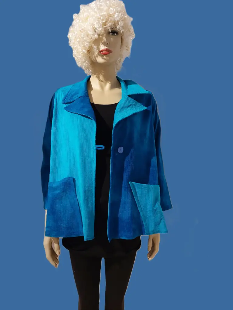 Mooi turquoise-kobaltblauw jasje van ribfluweel